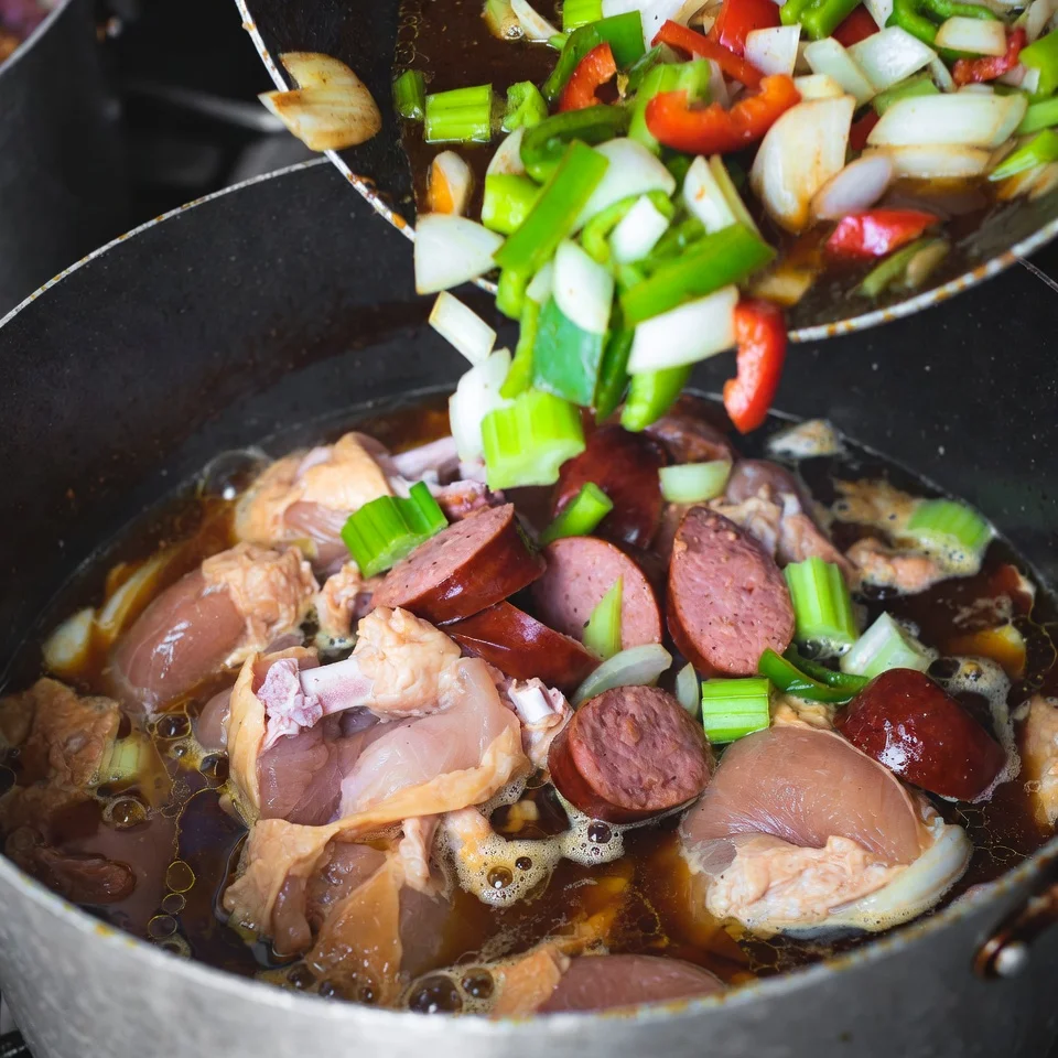 Chicken gumbo with andouille sausage served in bowl