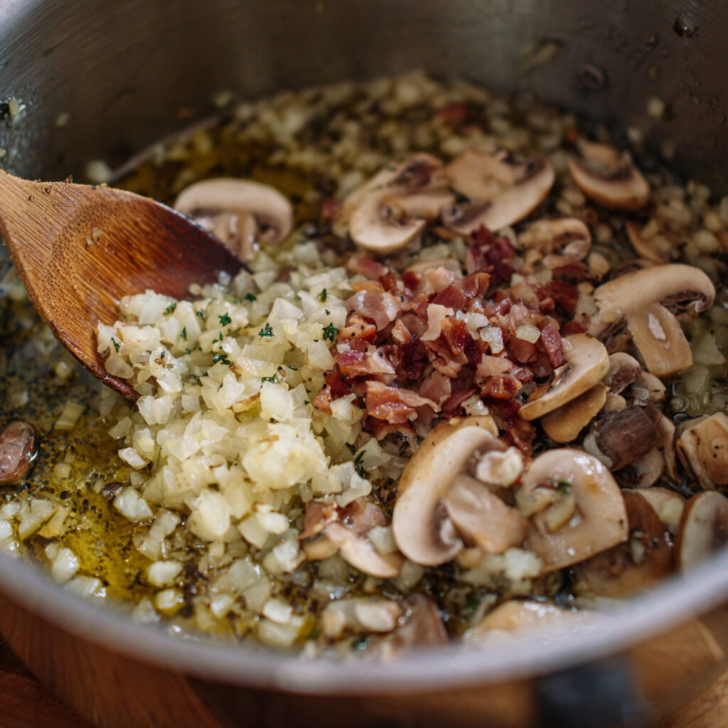 close up of chopped onion and minced garlic cookin