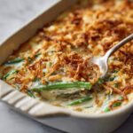 close up of baked green bean casserole being serve 1